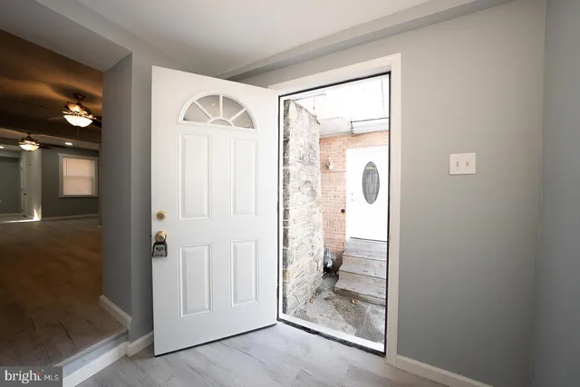 a view of a bathroom from a hallway