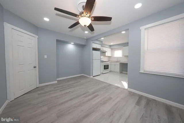 a view of a kitchen with a dishwasher and a refrigerator