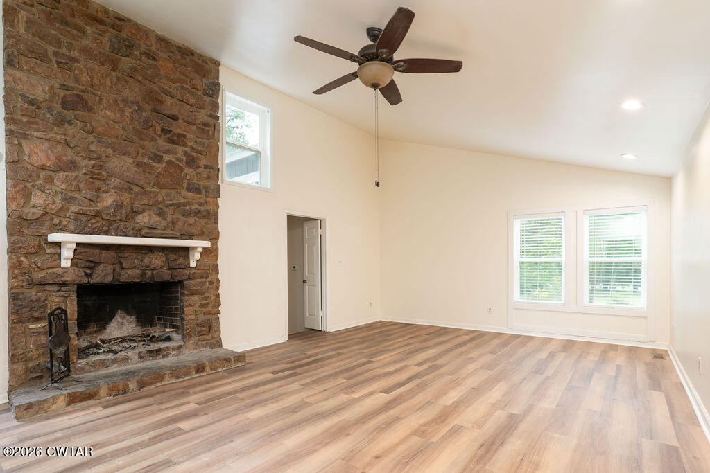 7 Timberlake Drive Jackson, TN 38305 - Photo 6 of 38 a bedroom with a bed and a fireplace