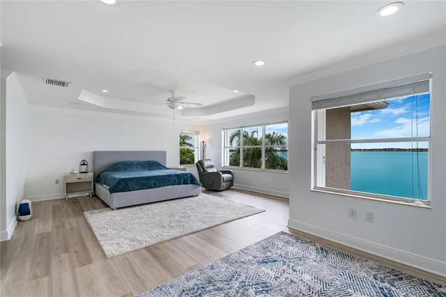 a bedroom with a large bed and a window