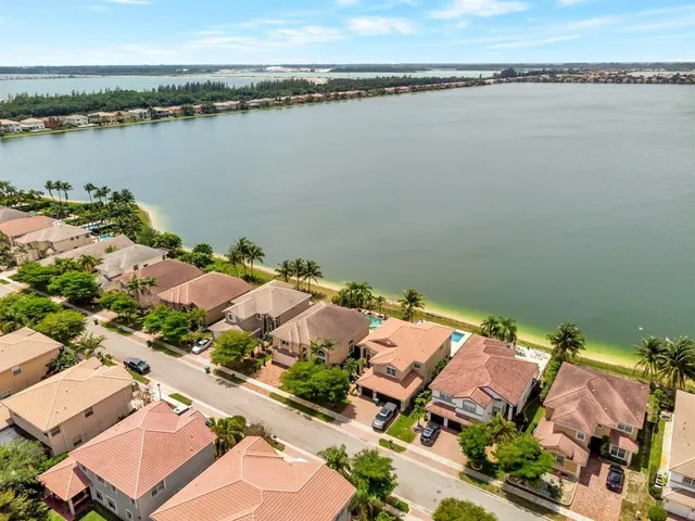 an aerial view of a house with a lake view