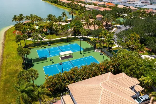 an aerial view of residential houses with outdoor space