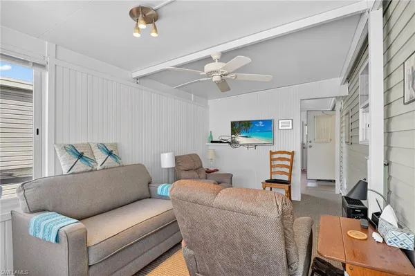 a living room with furniture and a table
