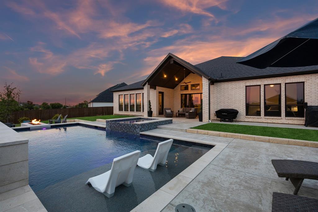 1908 Lotus Court Haslet, TX 76052 - Photo 5 of 40 Resort-Style Oasis With Sleek Design, Water Wall, And Tanning Ledge
