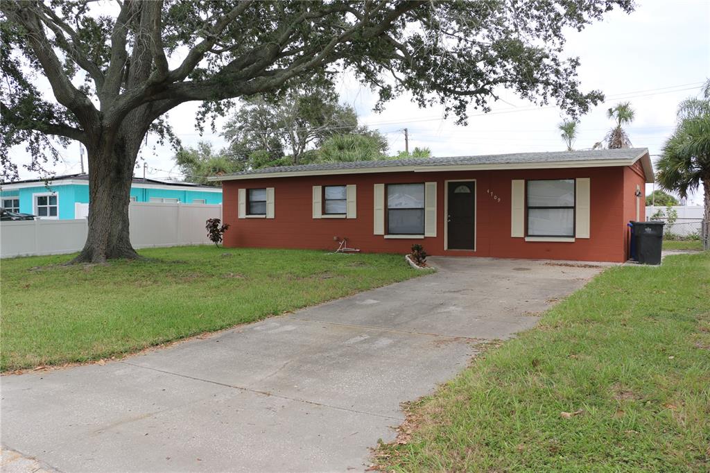 Undisclosed Address Tampa, FL 33615 - Photo 1 of 1 front view of a house with a yard