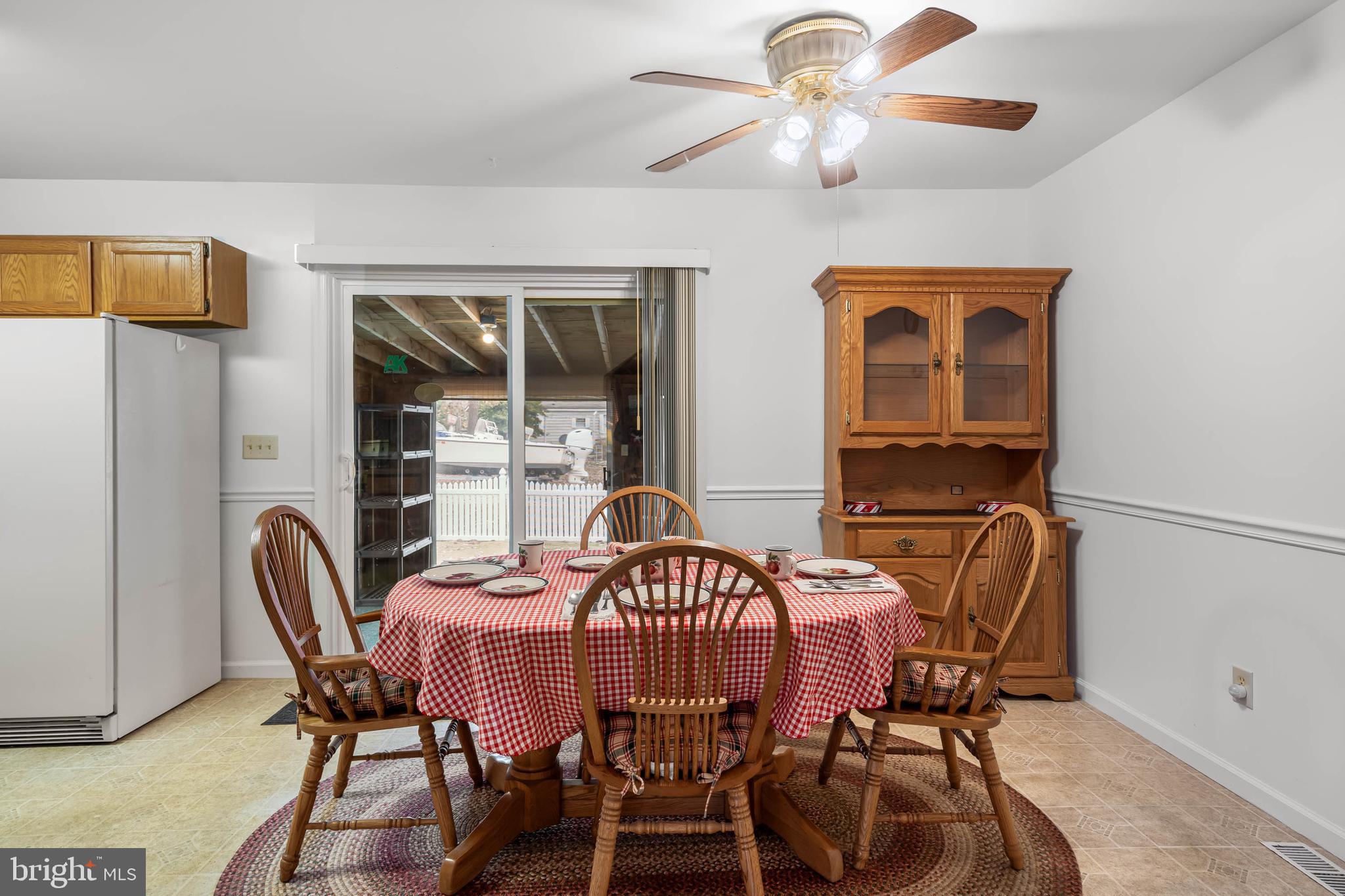 37526 Oak Street Ocean View, DE 19970 - Photo 14 of 36 a view of a dining room with furniture and window