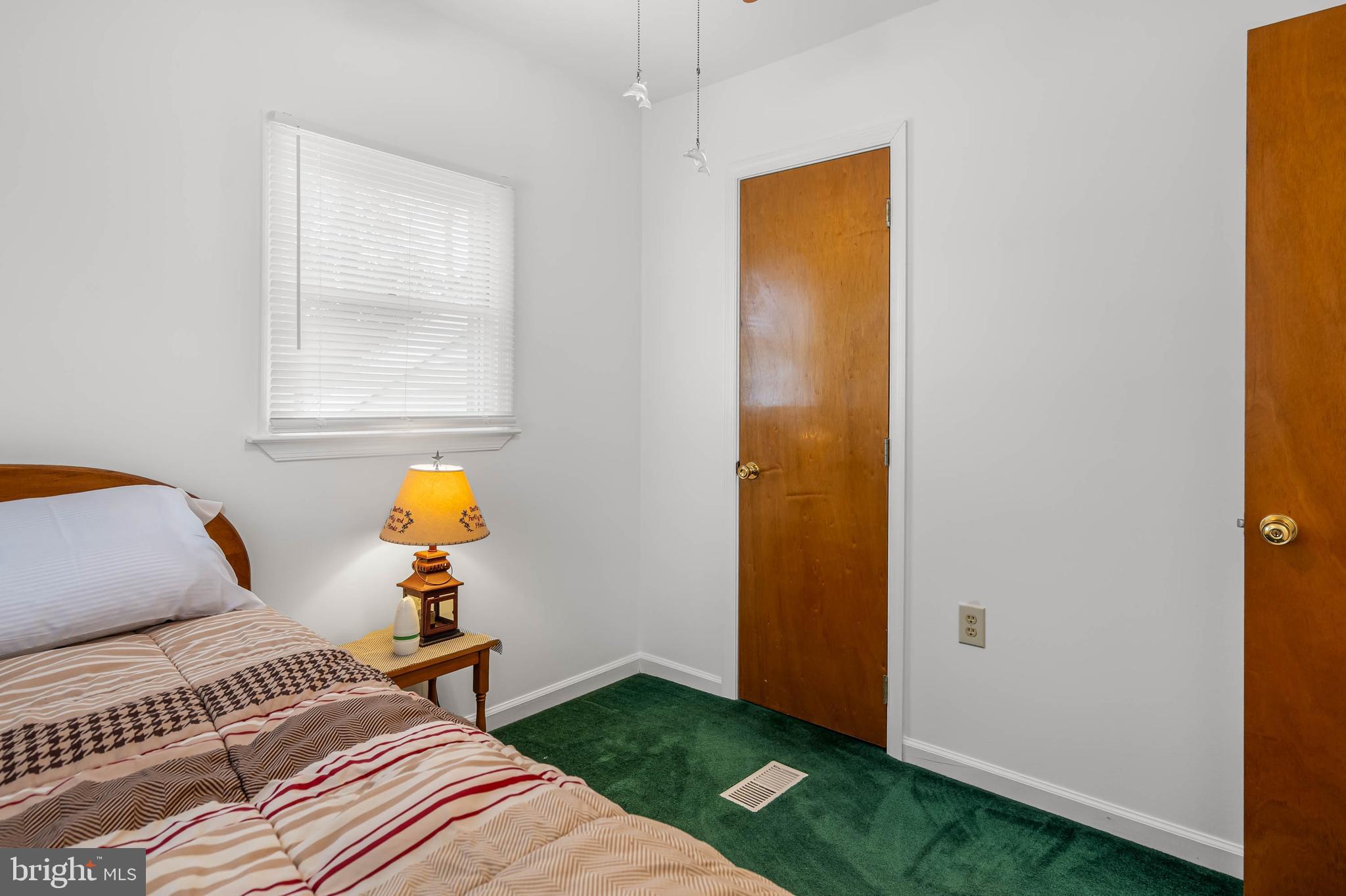 37526 Oak Street Ocean View, DE 19970 - Photo 26 of 36 a bedroom with a bed and a window
