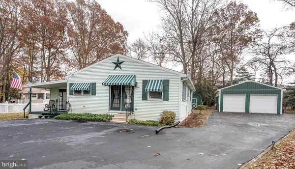 a front view of a house with a garage