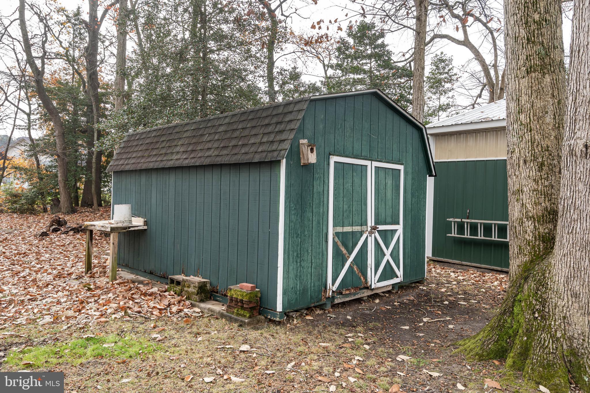 37526 Oak Street Ocean View, DE 19970 - Photo 8 of 36 a backyard of a house with seating space