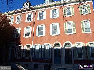 a front view of a multi story residential apartment building