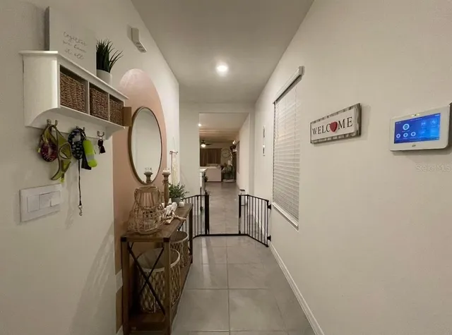 a view of a livingroom with furniture and entryway
