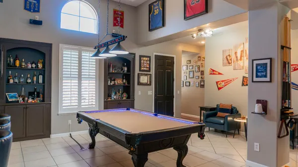 a kitchen with granite countertop a sink a counter top space and cabinets
