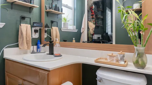 a bathroom with a toilet and a sink