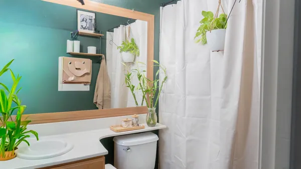 a en suite bathroom with a sink and a mirror
