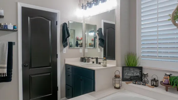 a view of a house with backyard porch and furniture