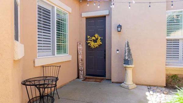 a view of a room that has a window and chair