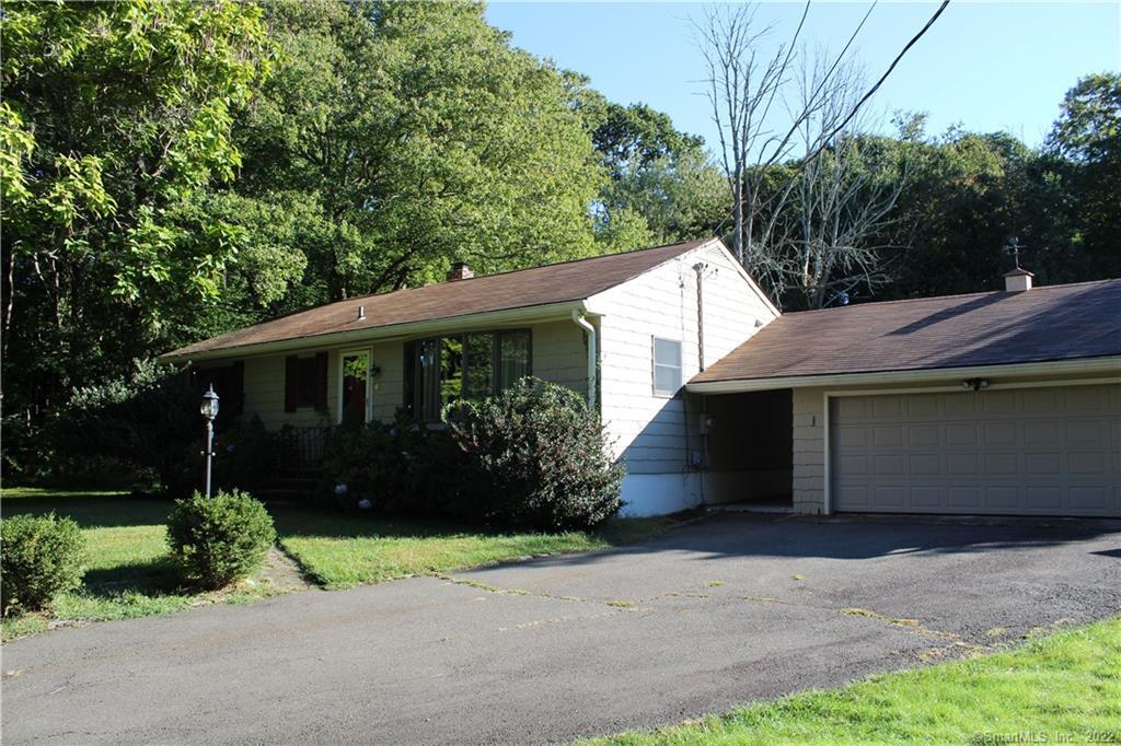 660 Booth Hill Road Shelton, CT 06484 - Photo 1 of 1 a front view of house with a garden