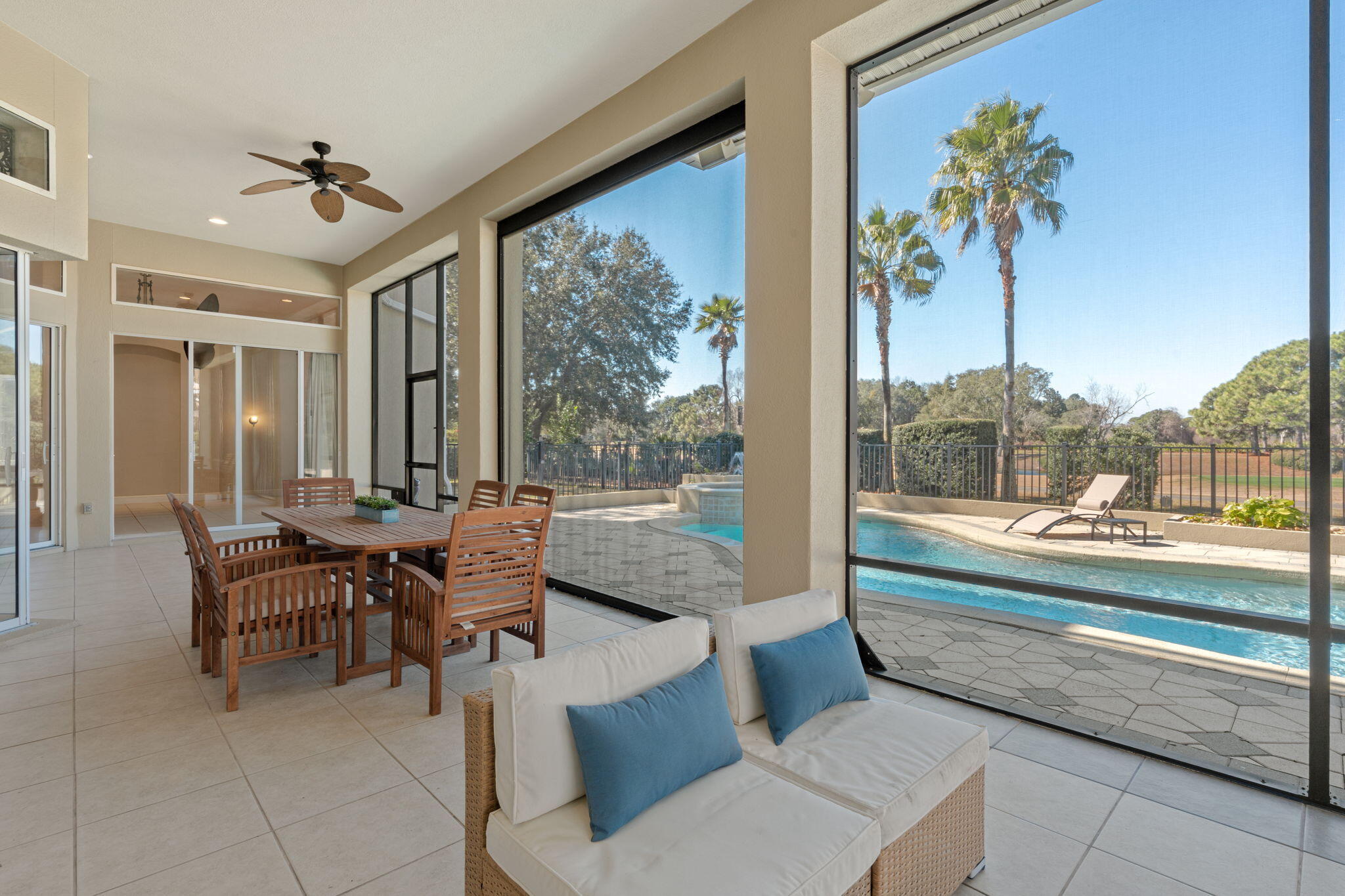 4327 Stonebridge Road Destin, FL 32541 - Photo 18 of 51 a dining room with furniture and a floor to ceiling window