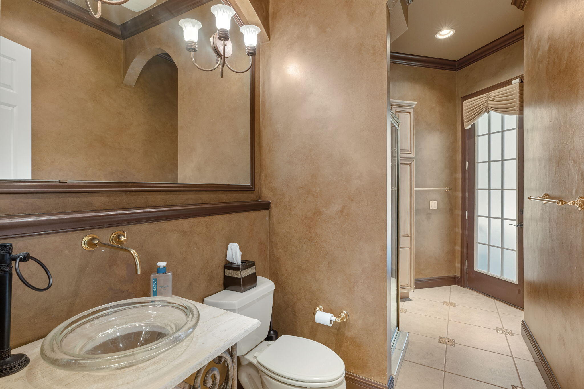 4327 Stonebridge Road Destin, FL 32541 - Photo 21 of 51 a bathroom with a toilet a sink and mirror