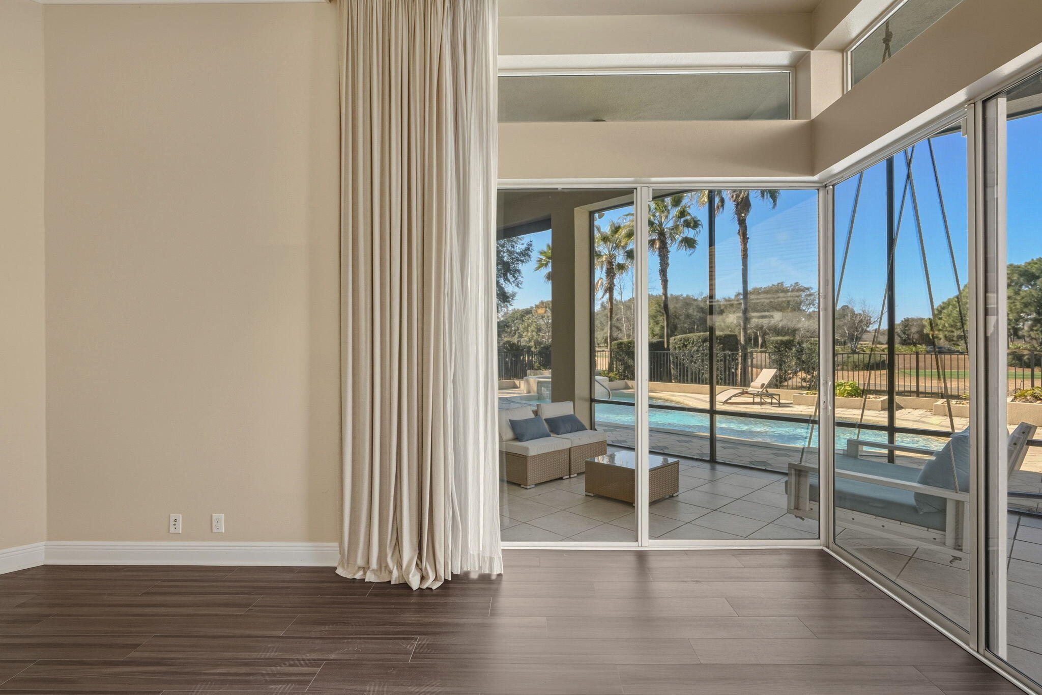 4327 Stonebridge Road Destin, FL 32541 - Photo 25 of 51 a view of a room with wooden floor and windows