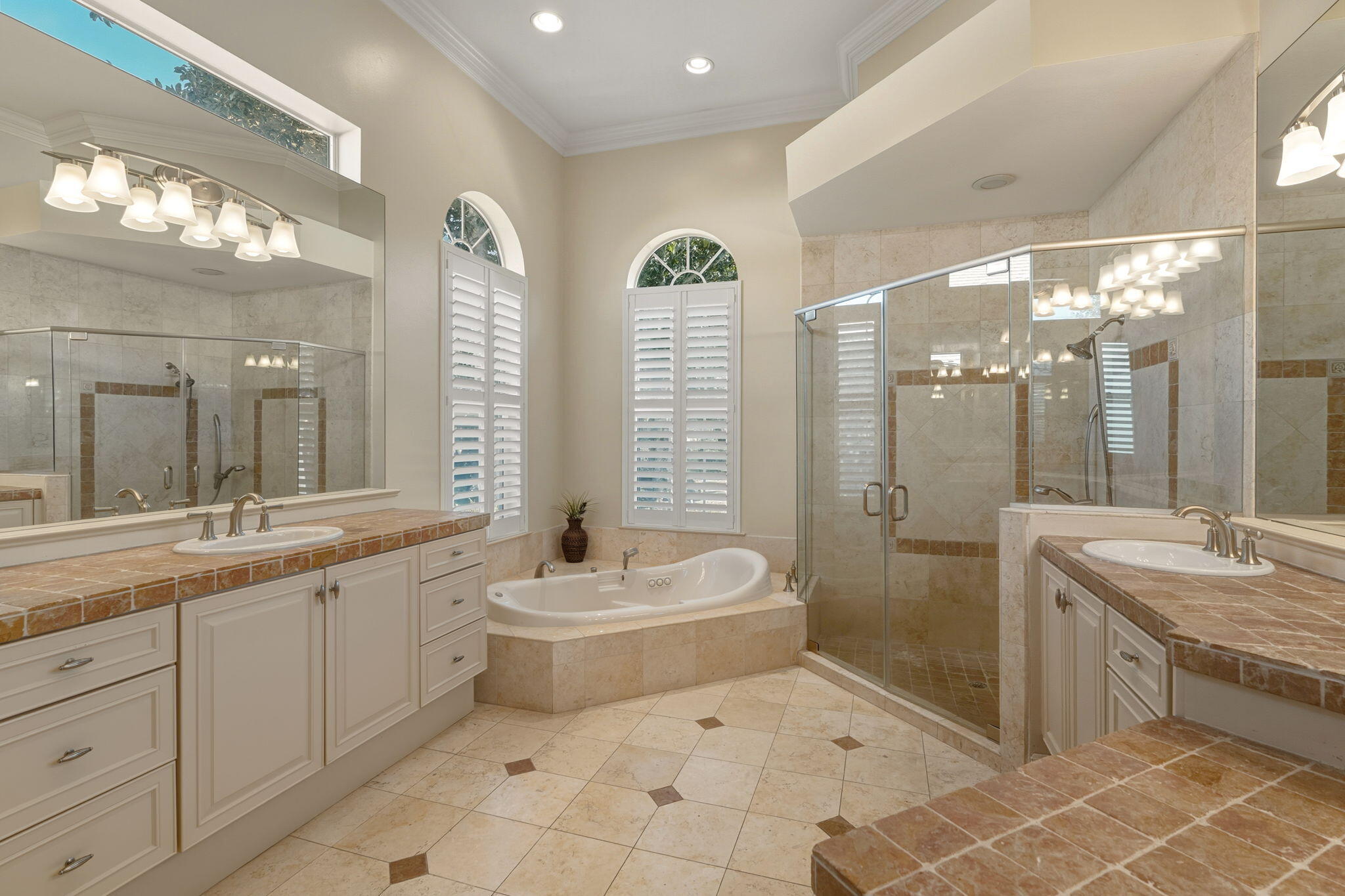 4327 Stonebridge Road Destin, FL 32541 - Photo 26 of 51 a bathroom with a sink a toilet a mirror and shower