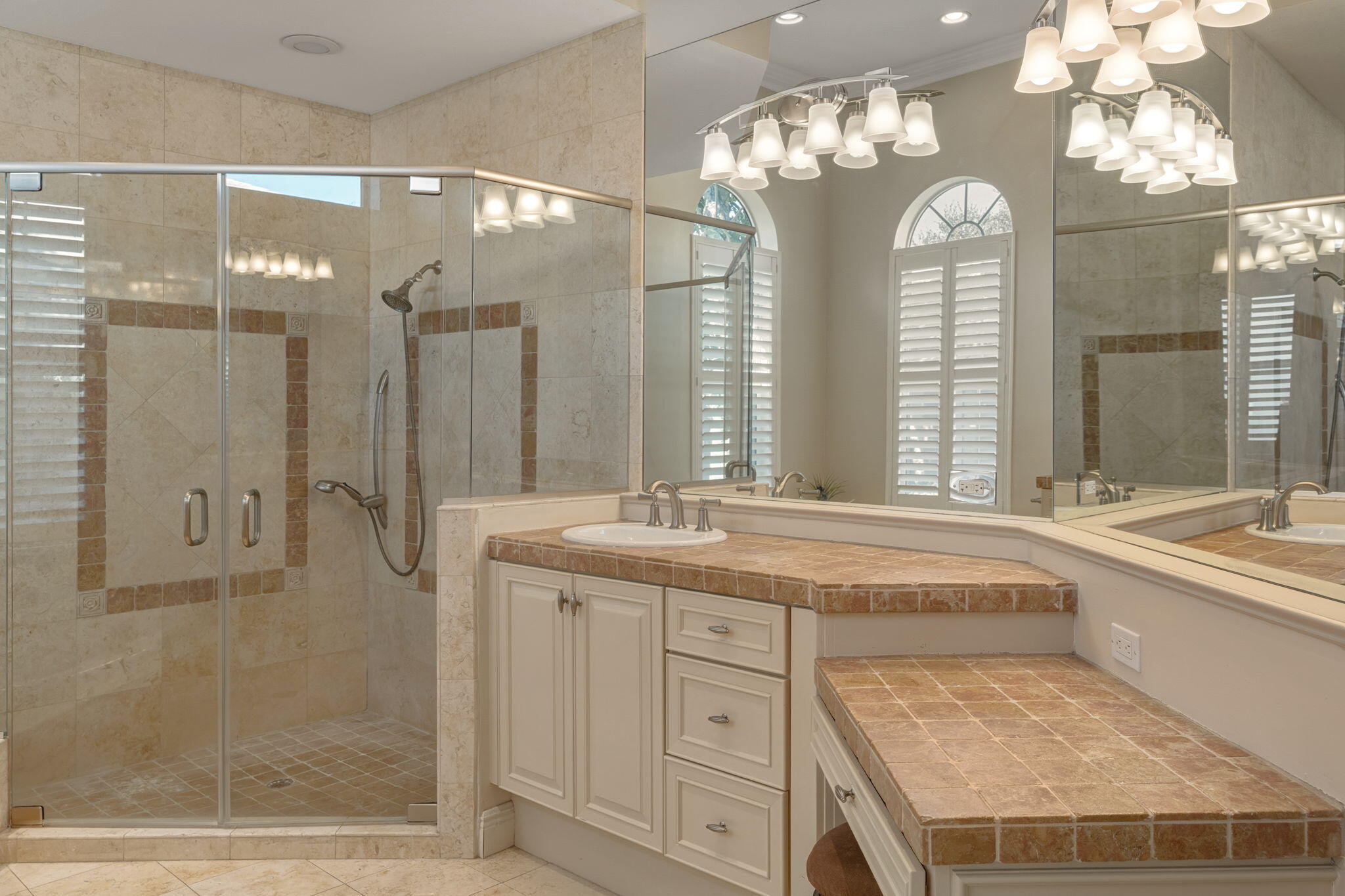 4327 Stonebridge Road Destin, FL 32541 - Photo 27 of 51 a bathroom with a granite countertop sink a large mirror and a bathtub next to a window