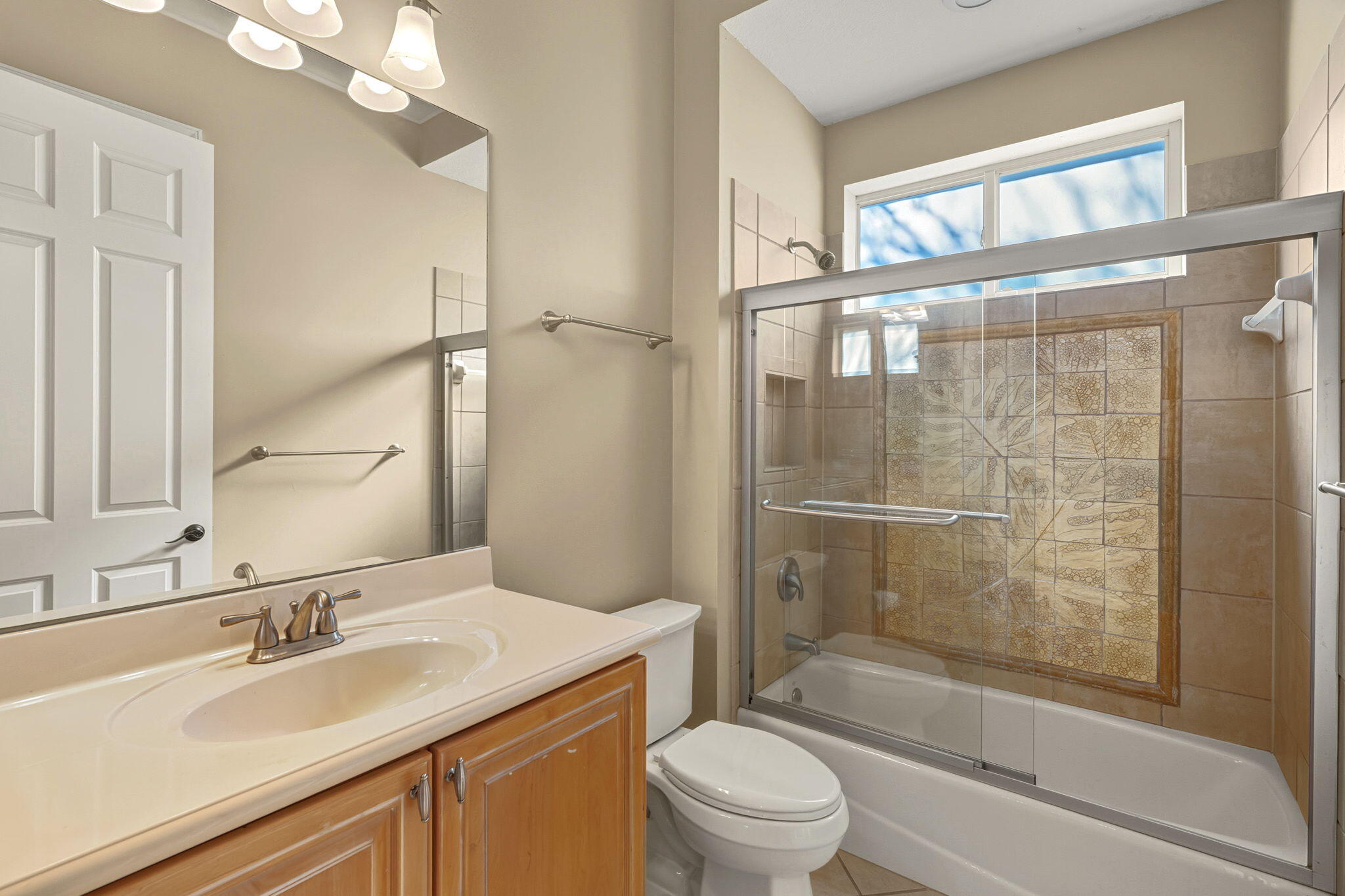 4327 Stonebridge Road Destin, FL 32541 - Photo 30 of 51 a bathroom with a sink a toilet and shower