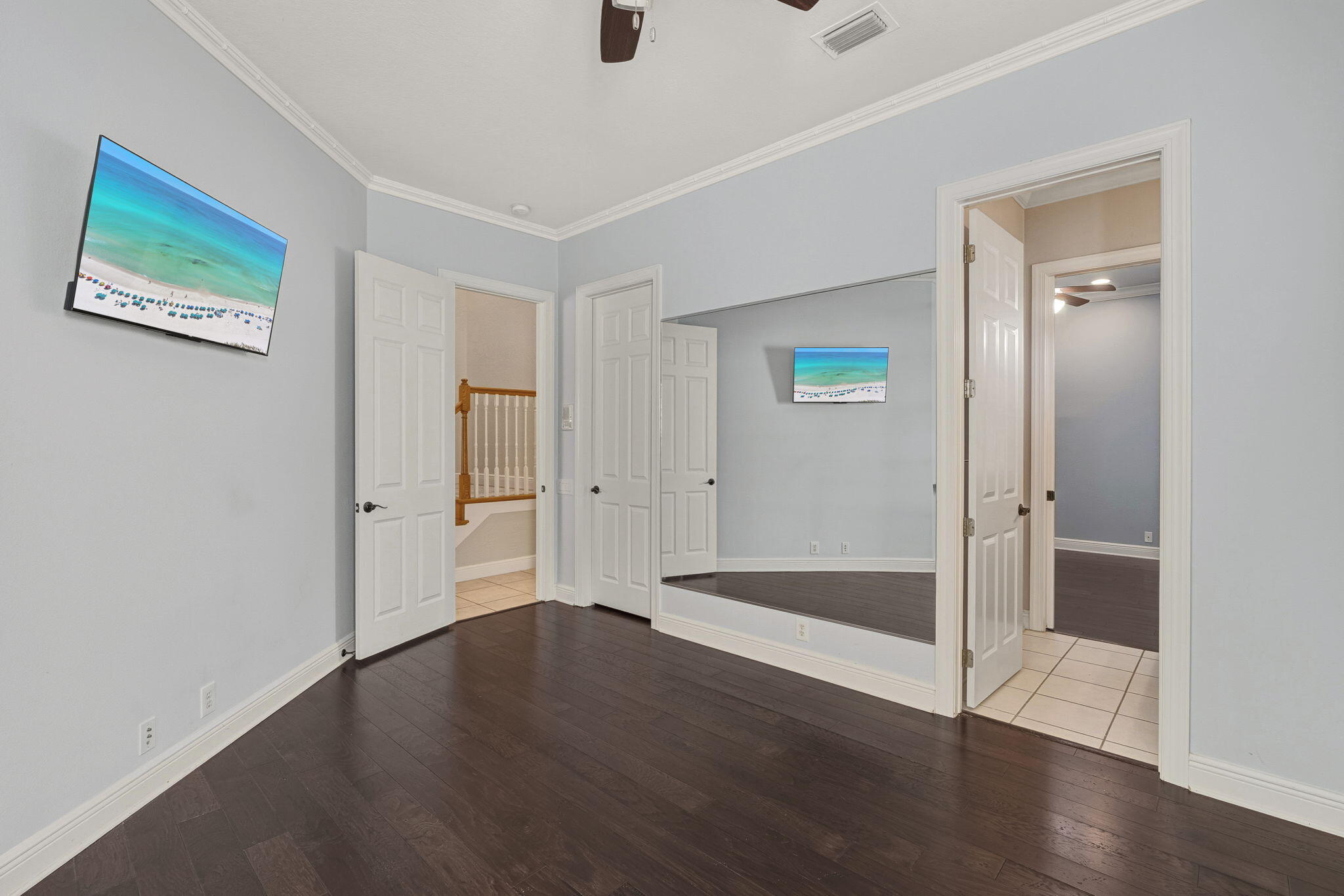4327 Stonebridge Road Destin, FL 32541 - Photo 32 of 51 an empty room with wooden floor and window