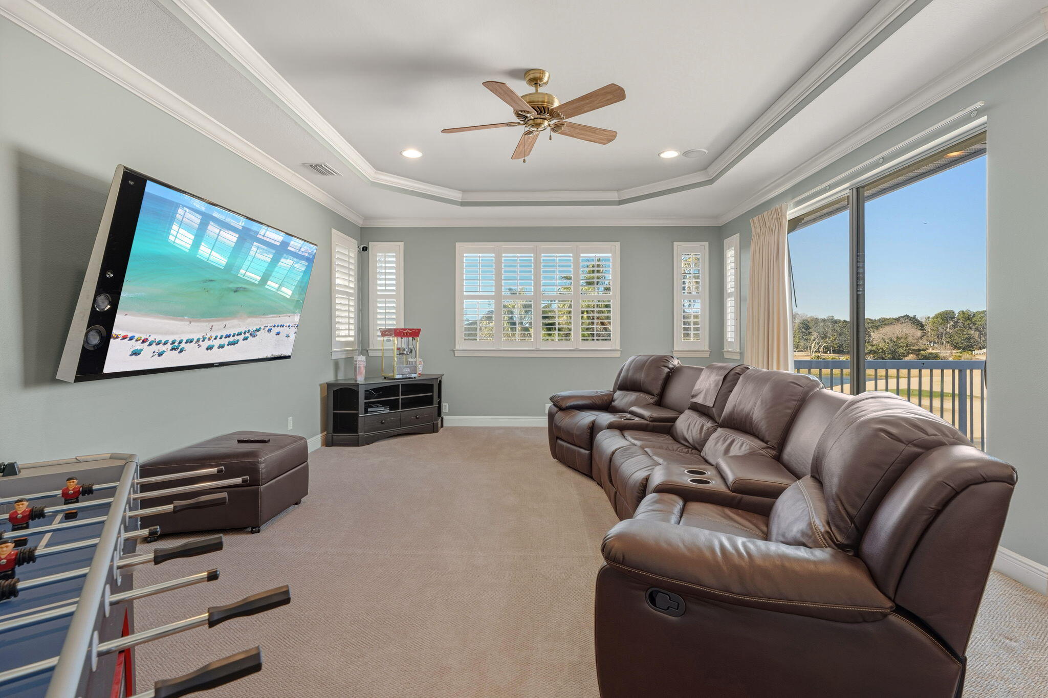 4327 Stonebridge Road Destin, FL 32541 - Photo 36 of 51 a living room with furniture a flat screen tv and a large window
