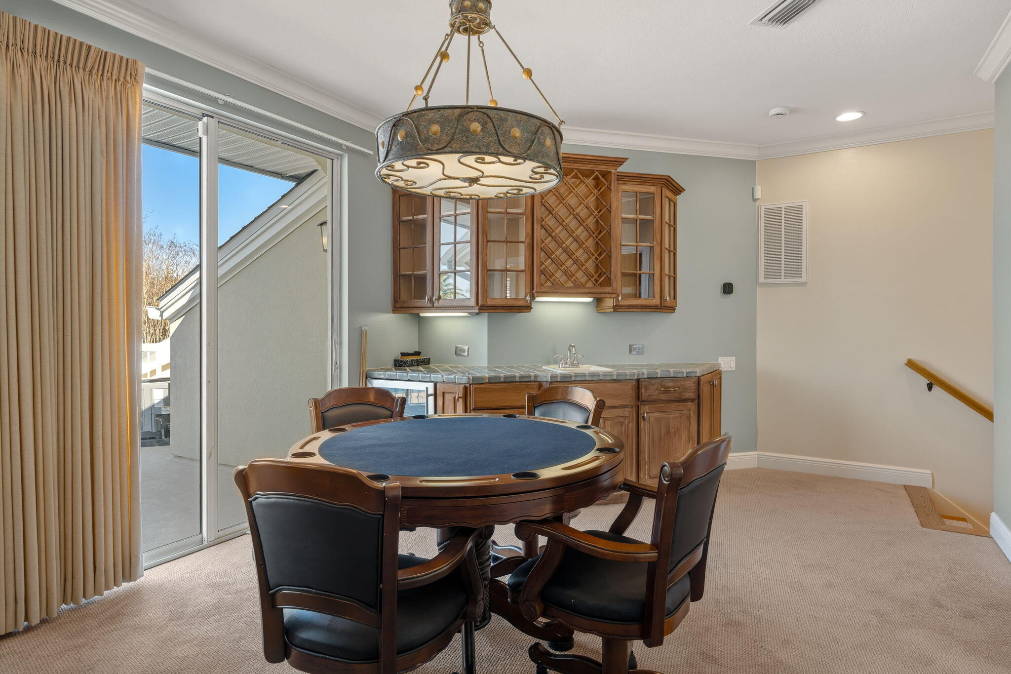 4327 Stonebridge Road Destin, FL 32541 - Photo 38 of 51 a view of a dining room with furniture and chandelier