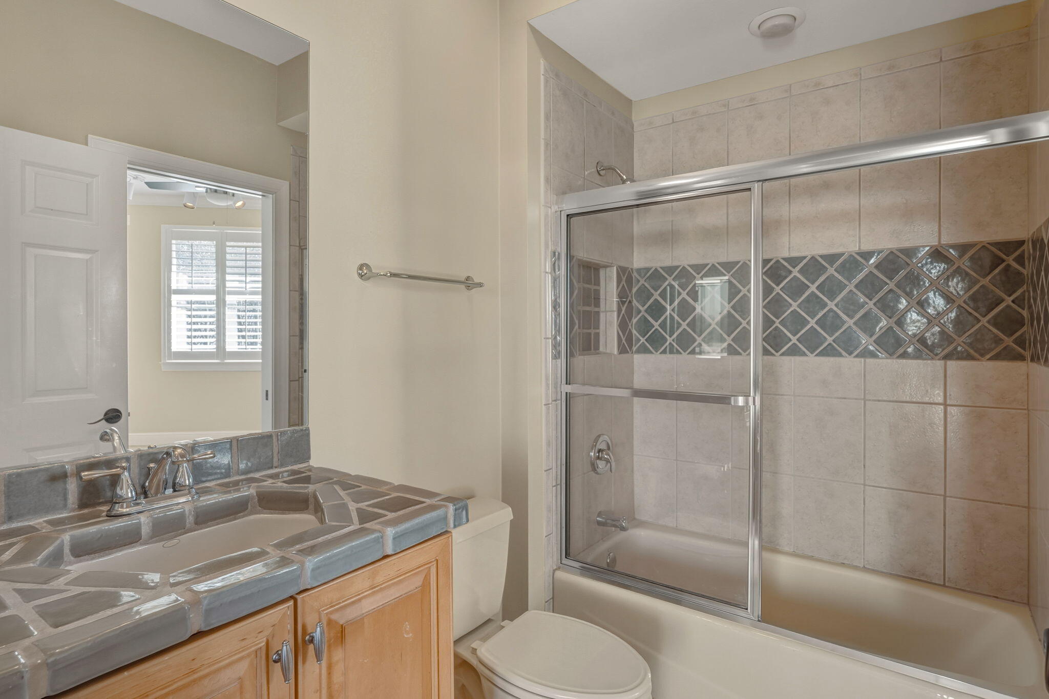 4327 Stonebridge Road Destin, FL 32541 - Photo 41 of 51 a bathroom with a granite countertop sink toilet and shower