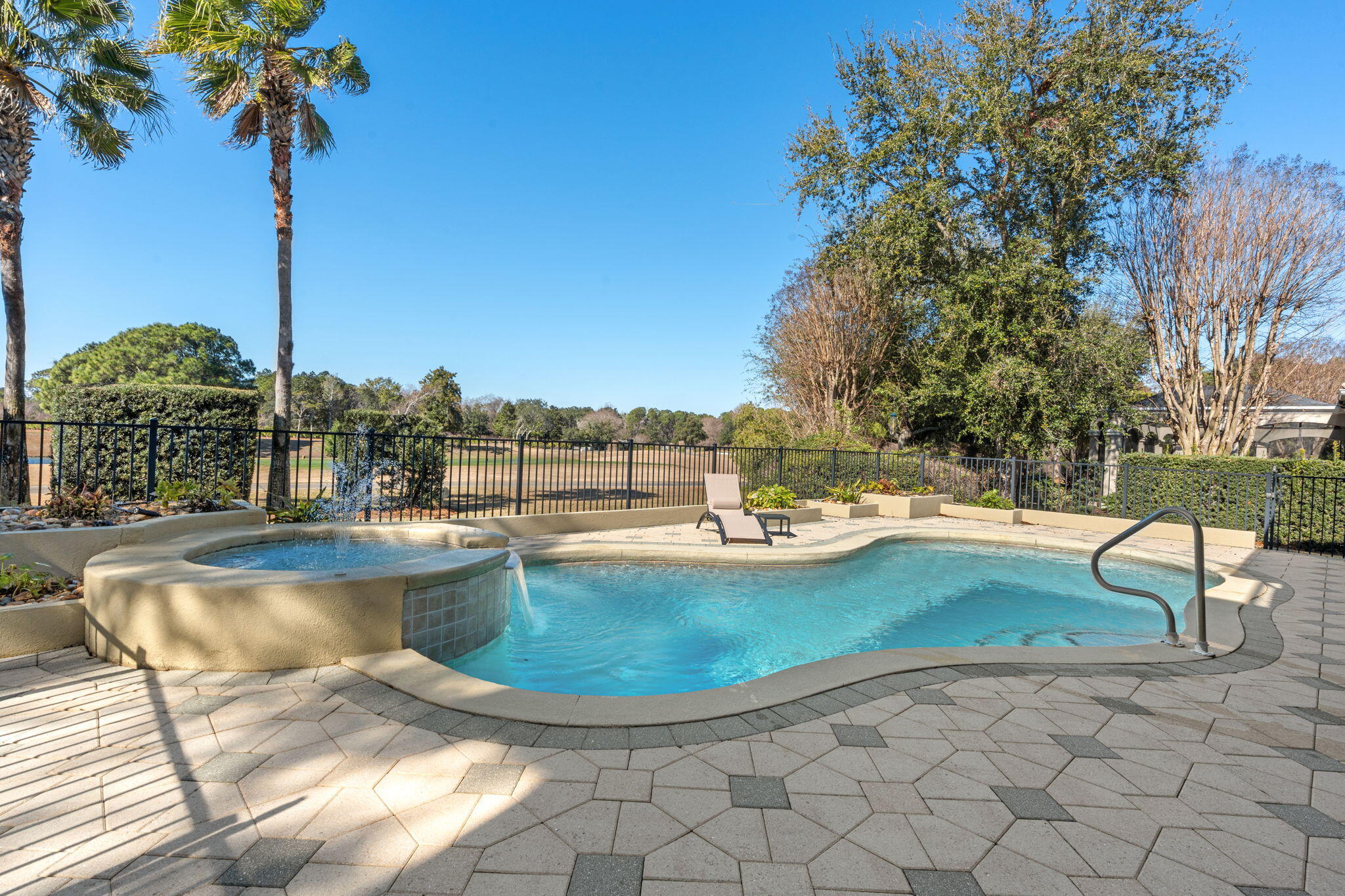 4327 Stonebridge Road Destin, FL 32541 - Photo 45 of 51 a view of a swimming pool with a sitting space