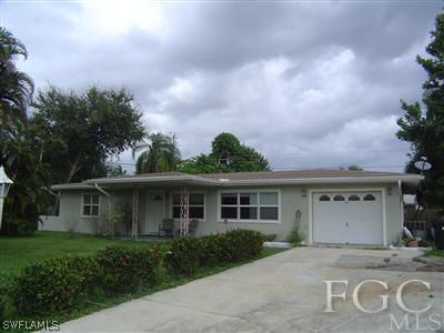 1433 Byron Road Fort Myers, FL 33919 - Photo 1 of 5 front view of a house with a garden