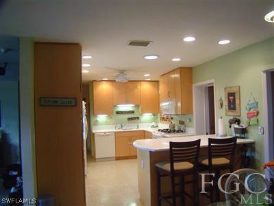 1433 Byron Road Fort Myers, FL 33919 - Photo 2 of 5 a kitchen with a table and chairs in it
