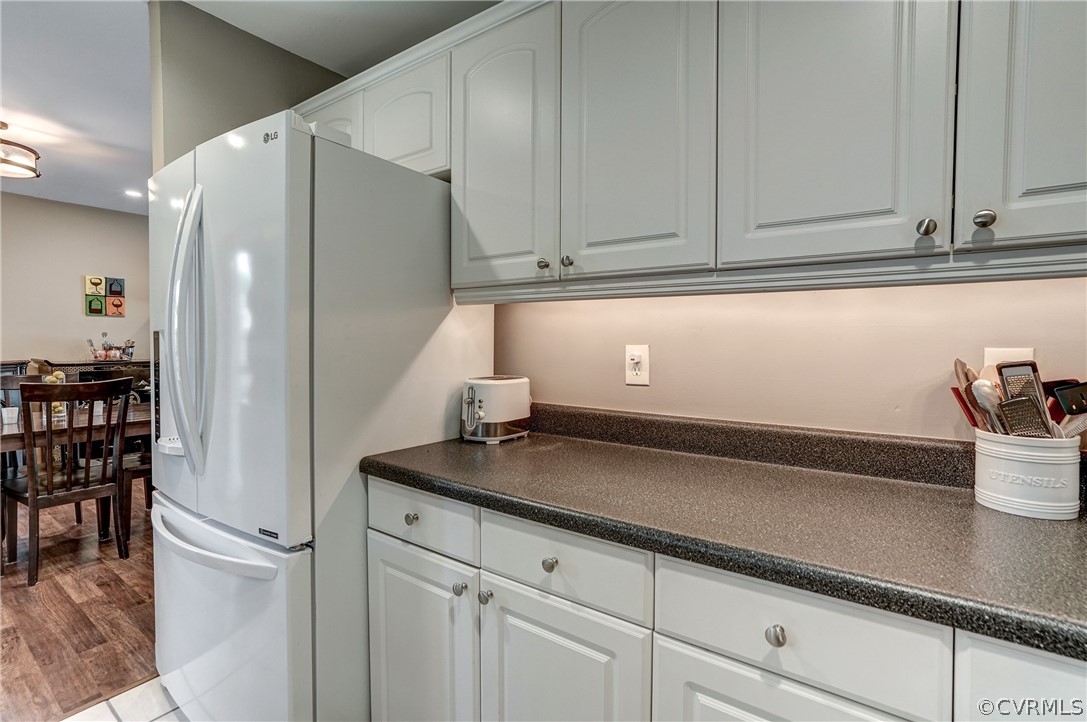 4801 Newbys Bridge Road Chesterfield, VA 23832 - Photo 13 of 34 a kitchen with stainless steel appliances white cabinets and a refrigerator