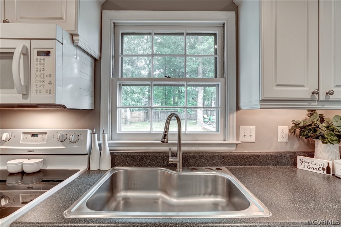 4801 Newbys Bridge Road Chesterfield, VA 23832 - Photo 14 of 34 a close view of a sink and dishwasher in kitchen with granite countertop