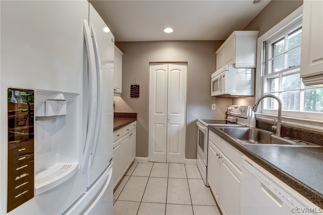 4801 Newbys Bridge Road Chesterfield, VA 23832 - Photo 15 of 34 a kitchen with a refrigerator and a sink