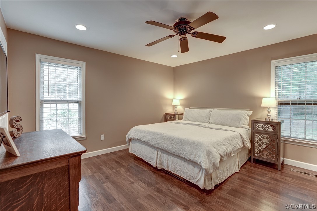 4801 Newbys Bridge Road Chesterfield, VA 23832 - Photo 16 of 34 a bedroom with a large bed a chandelier and a window