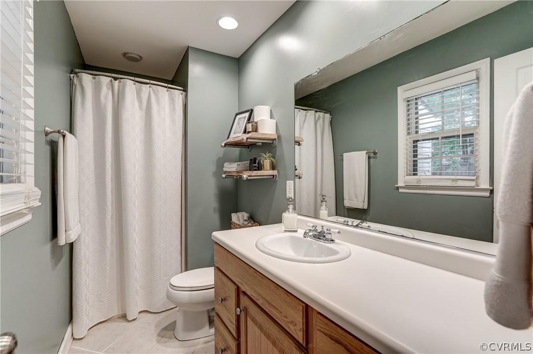 4801 Newbys Bridge Road Chesterfield, VA 23832 - Photo 18 of 34 a bathroom with a sink toilet and shower