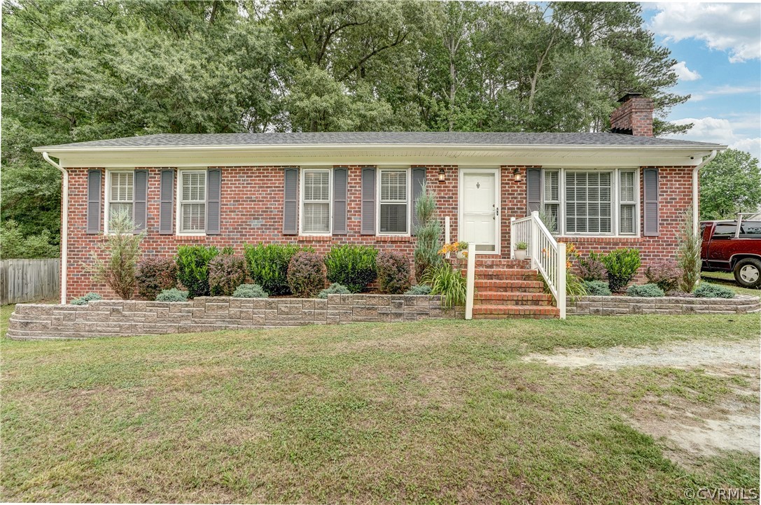 4801 Newbys Bridge Road Chesterfield, VA 23832 - Photo 2 of 34 a front view of a house with garden