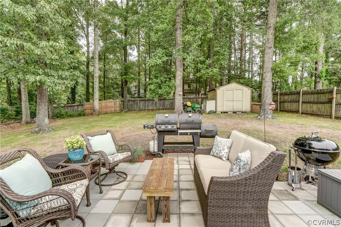4801 Newbys Bridge Road Chesterfield, VA 23832 - Photo 24 of 34 a view of a patio with couches chairs and a fire pit