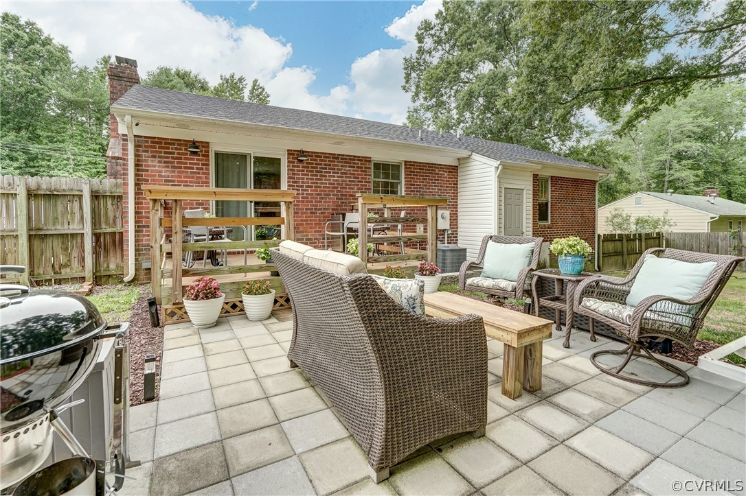 4801 Newbys Bridge Road Chesterfield, VA 23832 - Photo 26 of 34 a view of a patio with couches table and chairs and potted plants