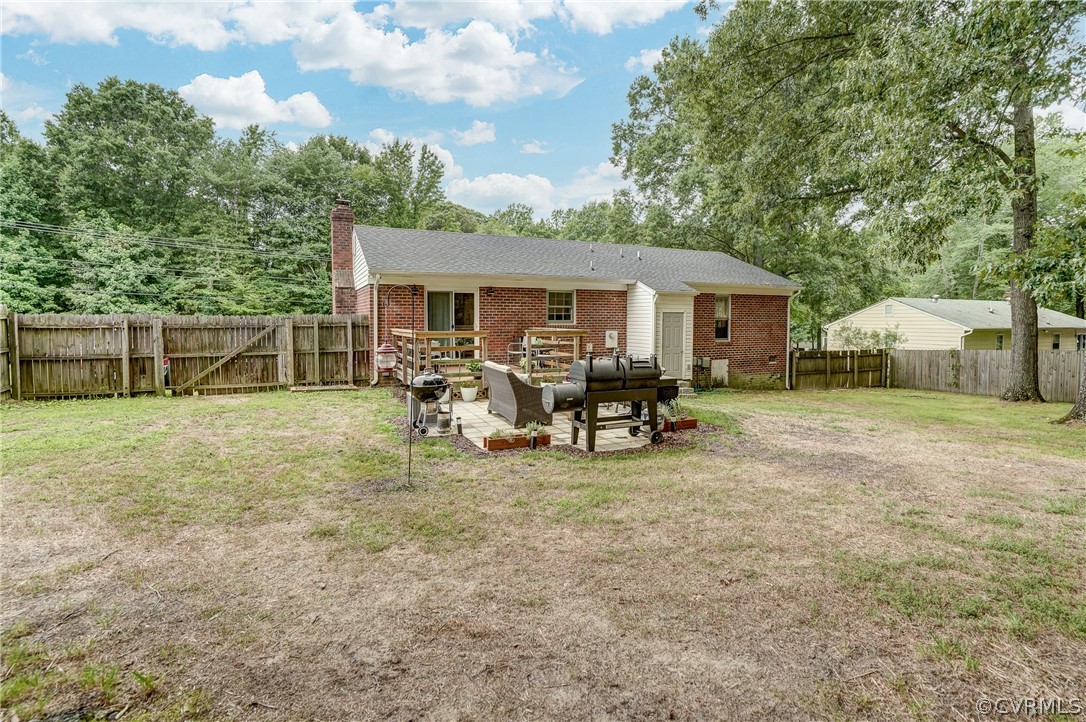 4801 Newbys Bridge Road Chesterfield, VA 23832 - Photo 28 of 34 a view of a house with backyard porch and sitting area