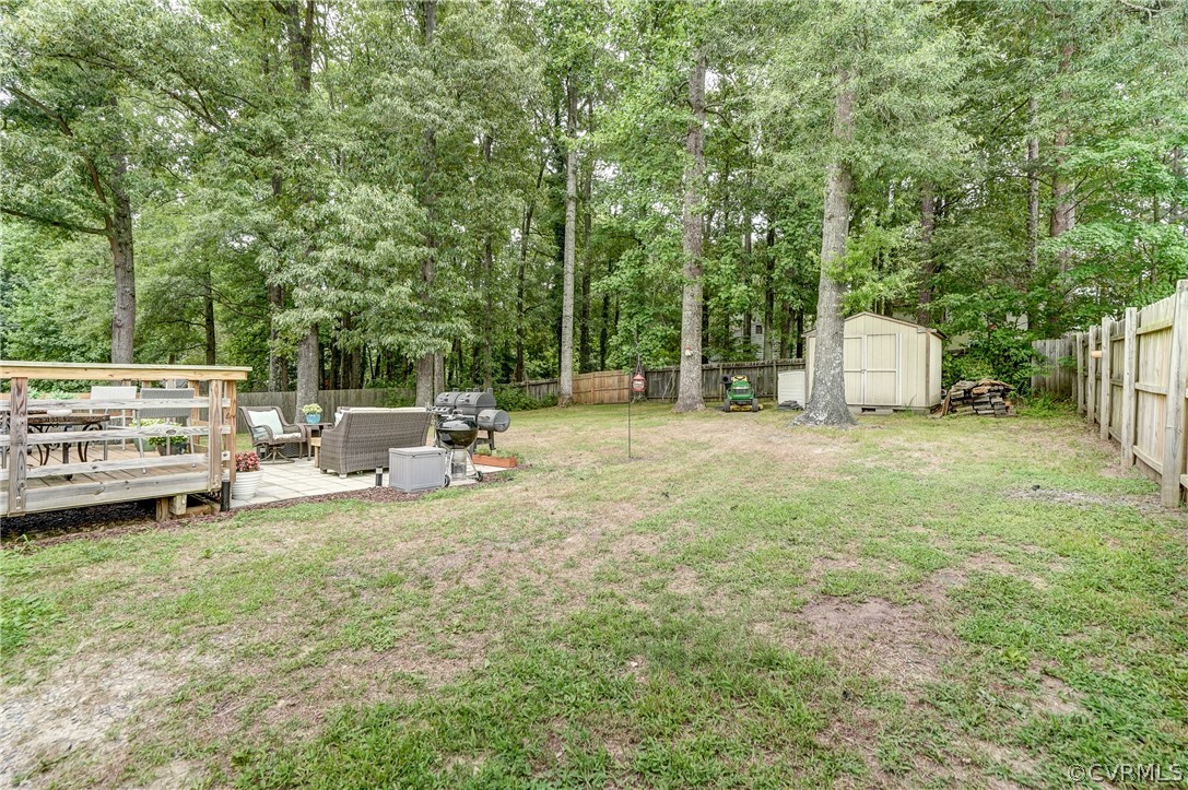 4801 Newbys Bridge Road Chesterfield, VA 23832 - Photo 29 of 34 a view of a house with backyard sitting area and garden