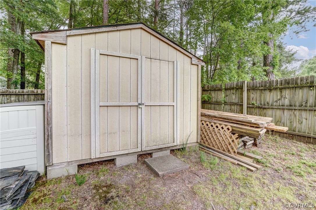 4801 Newbys Bridge Road Chesterfield, VA 23832 - Photo 31 of 34 a backyard of a house with wooden floor and fence