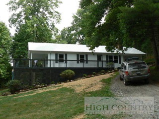 717 Ben Miller Road Deep Gap, NC 28618 - Photo 1 of 1 a view of house with yard entertaining space and outdoor seating
