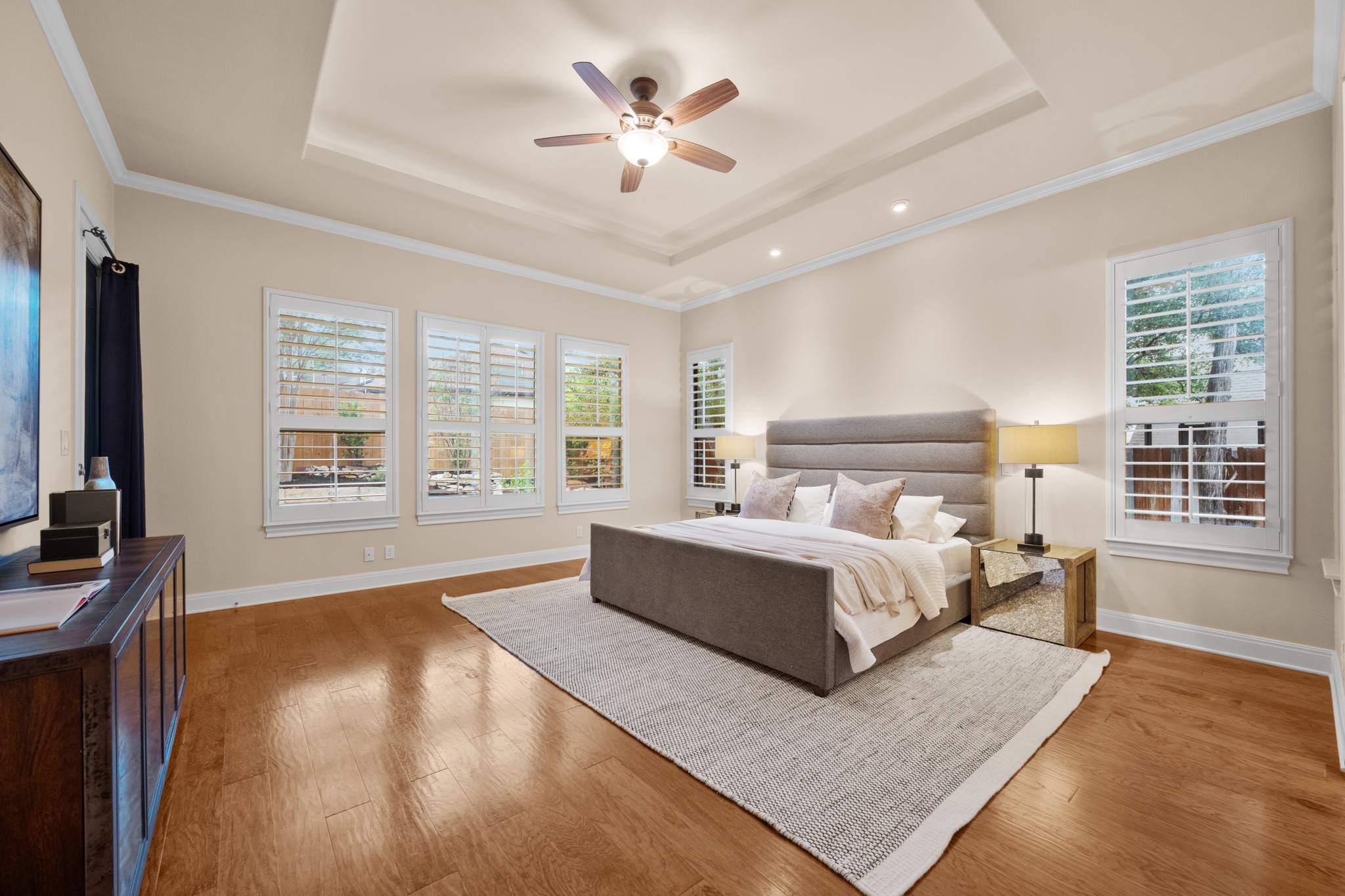 1012 Sailmaster Street Lakeway, TX 78734 - Photo 12 of 26 a spacious bedroom with a large bed and a couch