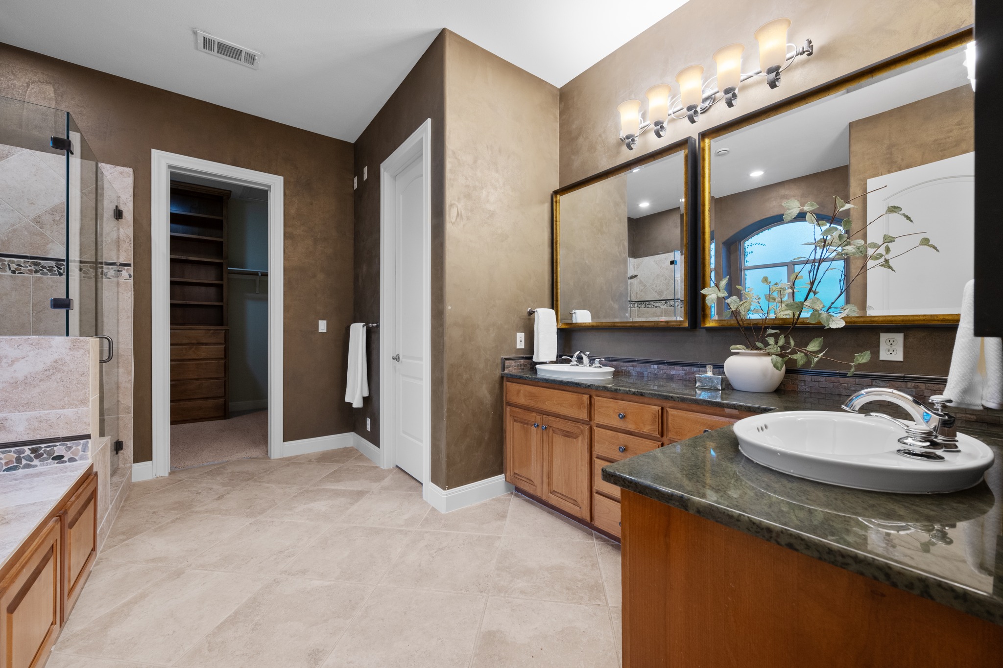 1012 Sailmaster Street Lakeway, TX 78734 - Photo 13 of 26 a bathroom with a granite countertop sink and a mirror