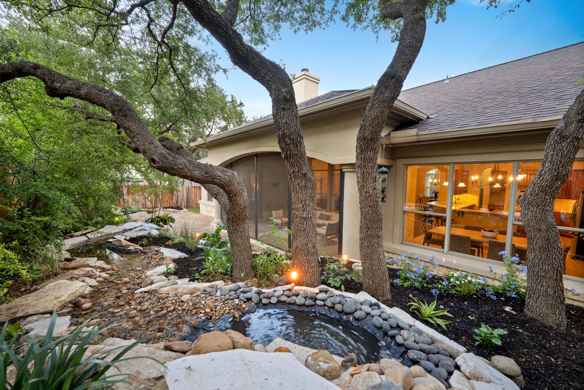 1012 Sailmaster Street Lakeway, TX 78734 - Photo 20 of 26 a front view of a house with garden