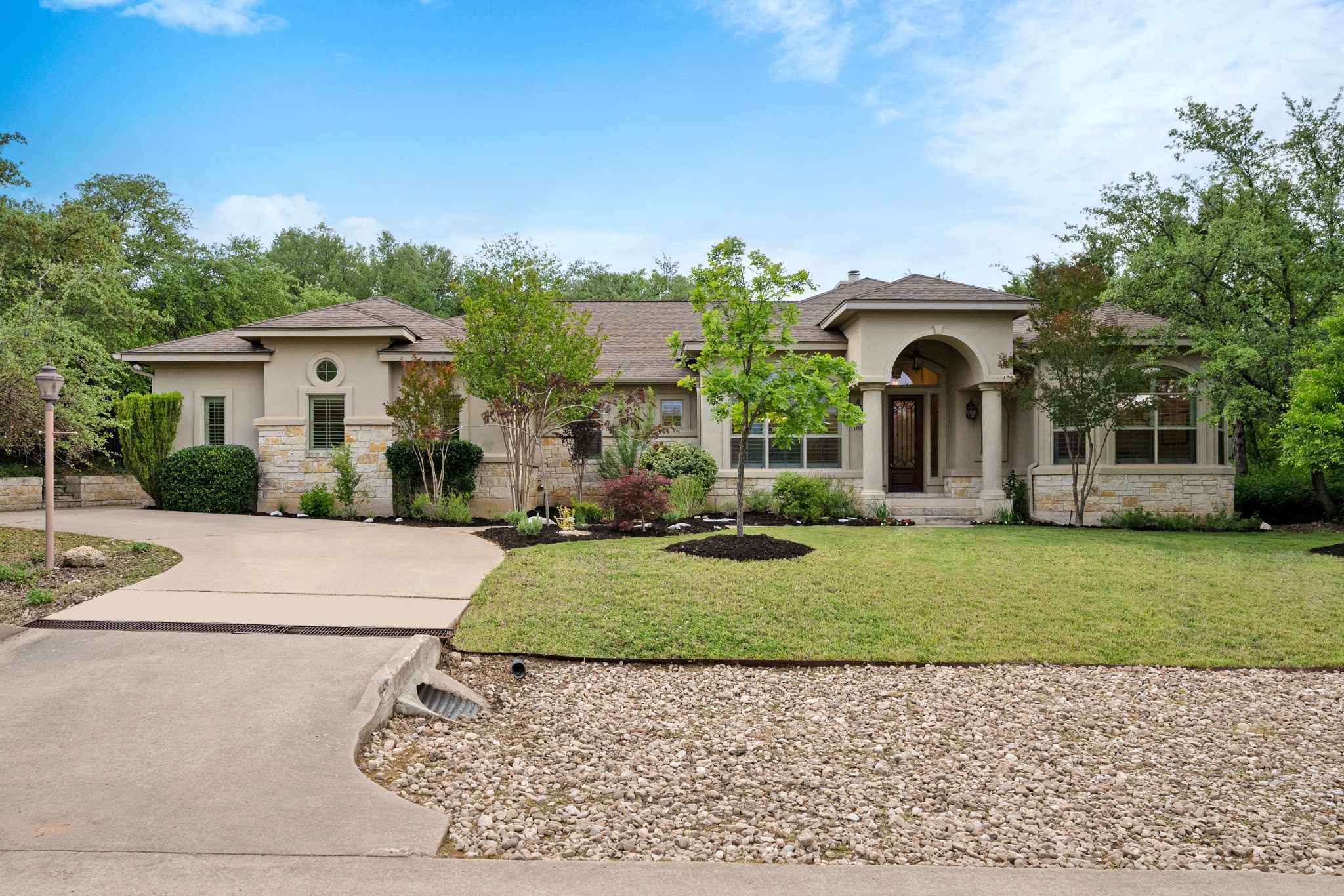 1012 Sailmaster Street Lakeway, TX 78734 - Photo 25 of 26 front view of a house with a yard